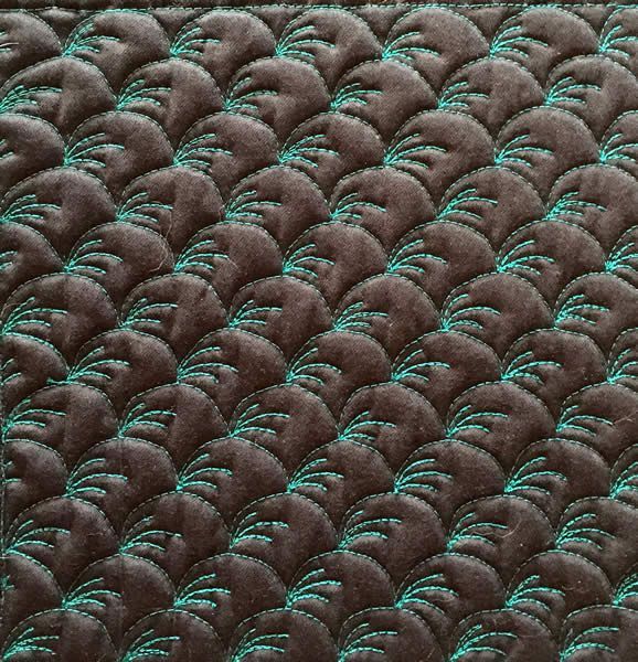 detail of a green quilt illustrating the types of machine quilting techniques Cindy teaches in her Clamshell Extravaganza! workshop