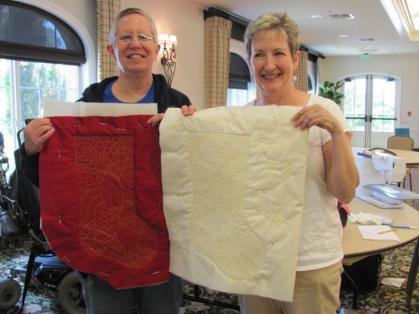 Linda and Nancy showing us their finished stockings