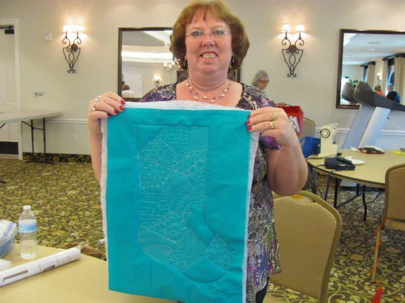 Sandy M. with her beautiful teal stocking project