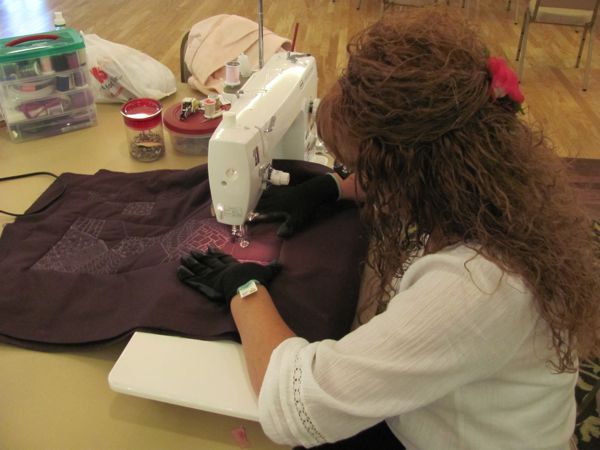 Laurie working hard on her maroon stocking